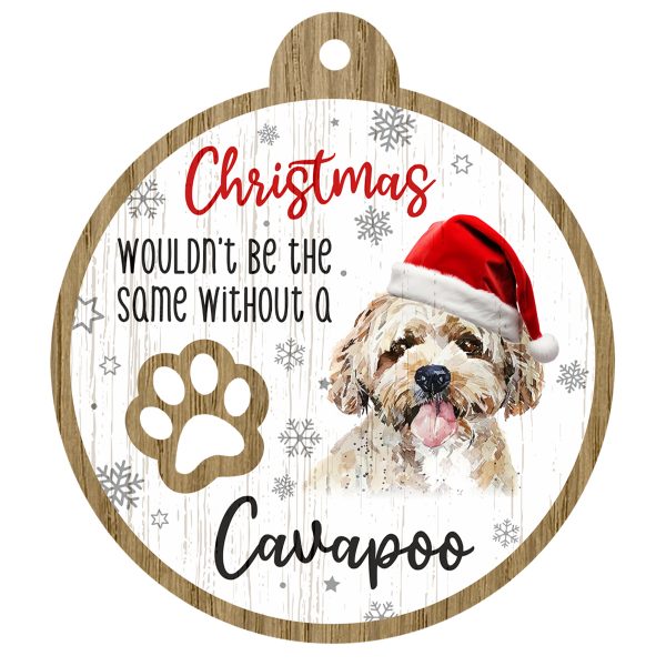 An image of a wooden christmas tree decoration with the wording - Christmas wouldn't be the same without a Cavapoo. There is a picture of the animal.