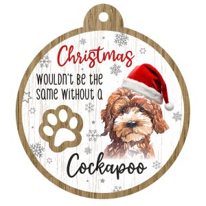 An image of a wooden christmas tree decoration with the wording - Christmas wouldn't be the same without a Cockapoo. There is a picture of the animal.