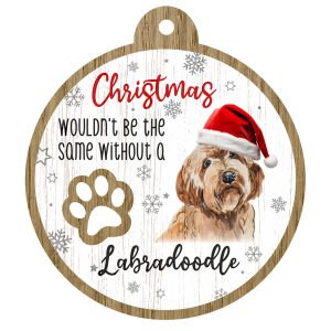 An image of a wooden christmas tree decoration with the wording - Christmas wouldn't be the same without a Labradoodle. There is a picture of the animal.
