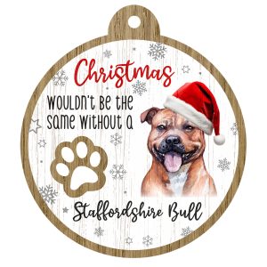 An image of a wooden christmas tree decoration with the wording - Christmas wouldn't be the same without a Staffordshire Bull. There is a picture of the animal.