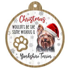 An image of a wooden christmas tree decoration with the wording - Christmas wouldn't be the same without a Yorkshire Terrier. There is a picture of the animal.