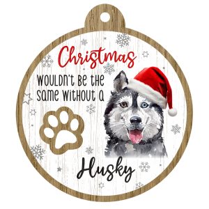 An image of a wooden christmas tree decoration with the wording - Christmas wouldn't be the same without a Husky. There is a picture of the animal.