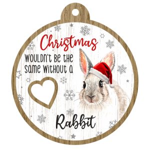 An image of a wooden christmas tree decoration with the wording - Christmas wouldn't be the same without a Rabbit. There is a picture of the animal.